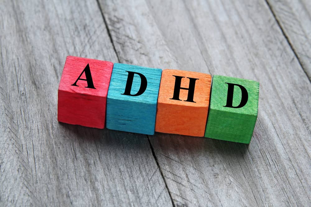 concept of ADHD on colorful wooden cubes